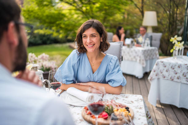 istock Intimate Terrace Dining Experience with Diverse Couple 2163672462