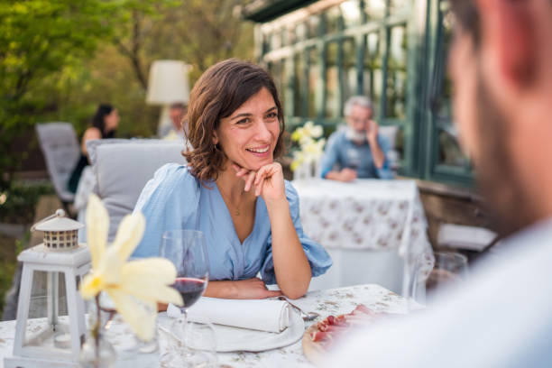 istock Diverse Couple Enjoying Outdoor Dining Experience 2163672467