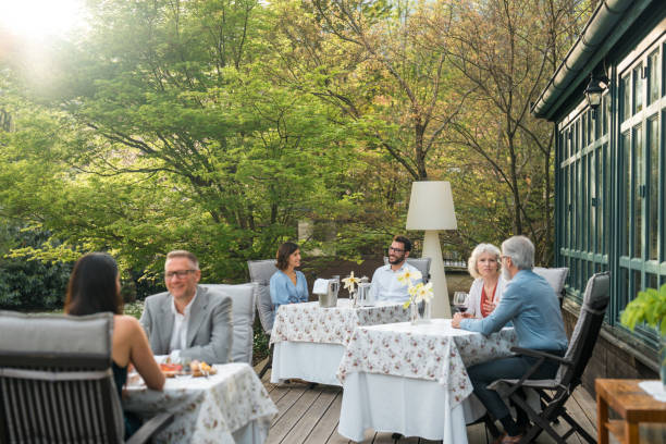 istock Diverse Group Enjoys Alfresco Dining at Boutique Hotel Terrace 2163672533