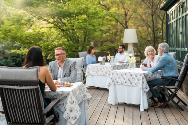 istock Multicultural Friends Enjoying Meal on Hotel Terrace 2163672536