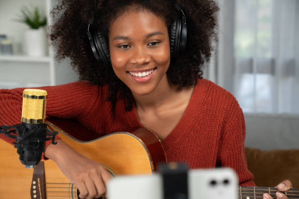 istock Young American African with selfie broadcasting on smartphone. Tastemaker. 2163672619