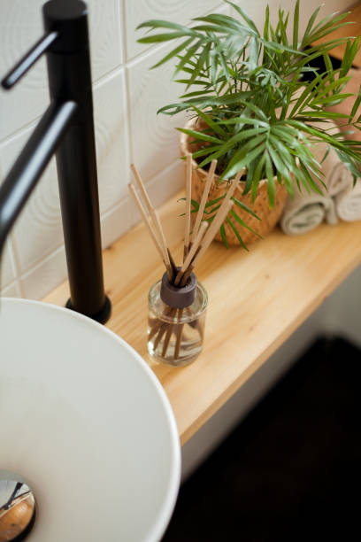 istock Bathroom in black and white. Home decor. Sink, hand towels, diffuser, house flower. Cozy. 2163675705