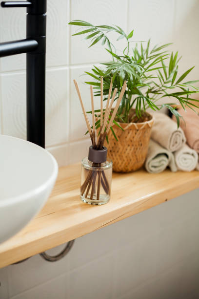 istock Bathroom in black and white. Home decor. Sink, hand towels, diffuser, house flower. Cozy. 2163675718