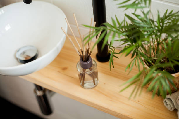 istock Bathroom in black and white. Home decor. Sink, hand towels, diffuser, house flower. Cozy. 2163675928