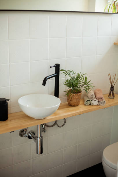 istock Bathroom in black and white. Home decor. Sink, hand towels, diffuser, house flower. Cozy. 2163676022