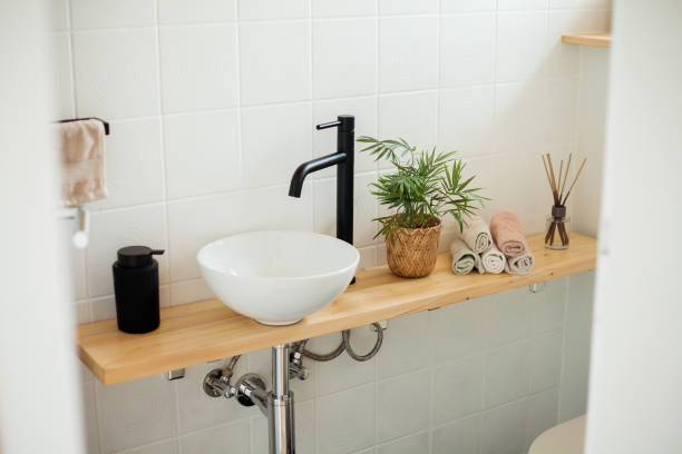 istock Bathroom in black and white. Home decor. Sink, hand towels, diffuser, house flower. Cozy. 2163676051