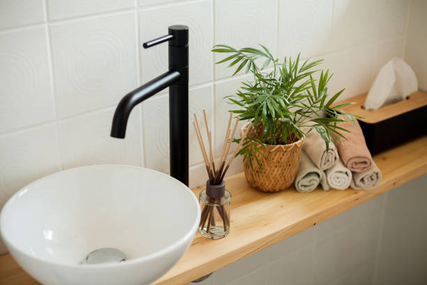 istock Bathroom in black and white. Home decor. Sink, hand towels, diffuser, house flower. Cozy. 2163676134