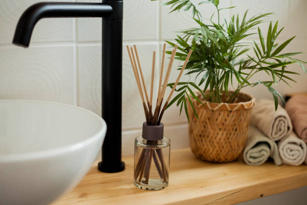 istock Bathroom in black and white. Home decor. Sink, hand towels, diffuser, house flower. Cozy. 2163676142