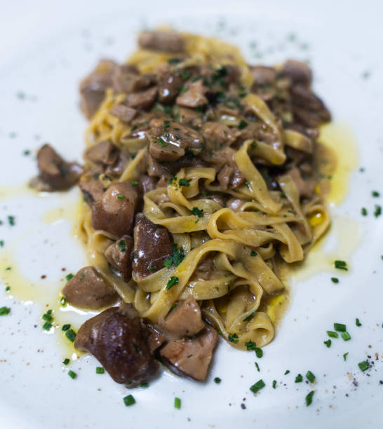 Tagliatelle with mushroom sauce - authentic fresh  italian pasta