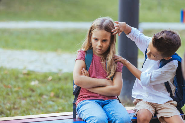 istock Caucasian Children by Schoolyard Bench 2163677075