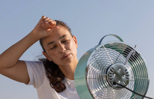 istock Woman with Fan 2163678362