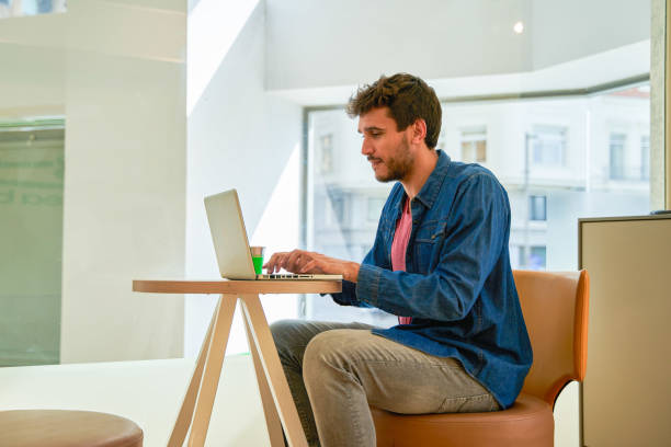 istock young student takes advantage of her coffee break to use her laptop computer 2163678540