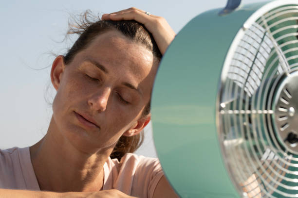 istock Woman with Fan 2163678610
