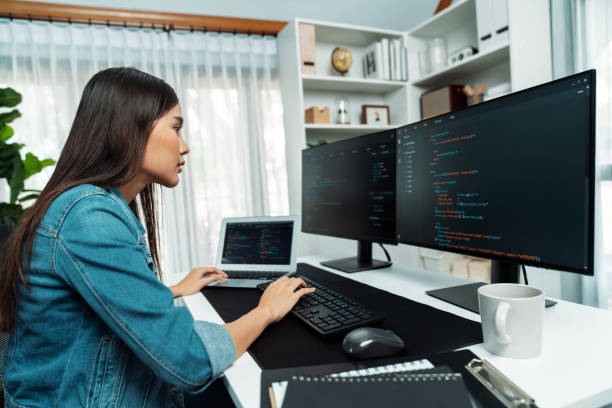 istock Young Asian in IT creating with typing online information on pc. Stratagem. 2163679228