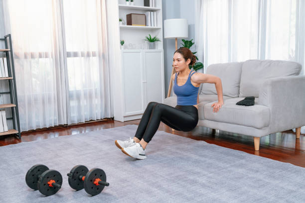 istock Energetic and determination asian woman push up on sofa. Vigorous 2163680573