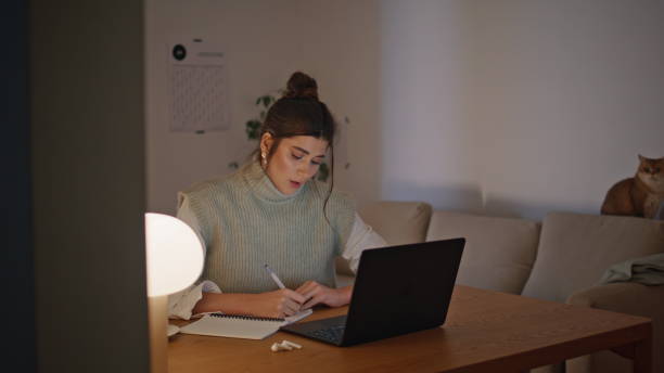 istock Organized student girl writing notebook evening workplace closeup. Woman working 2163681271