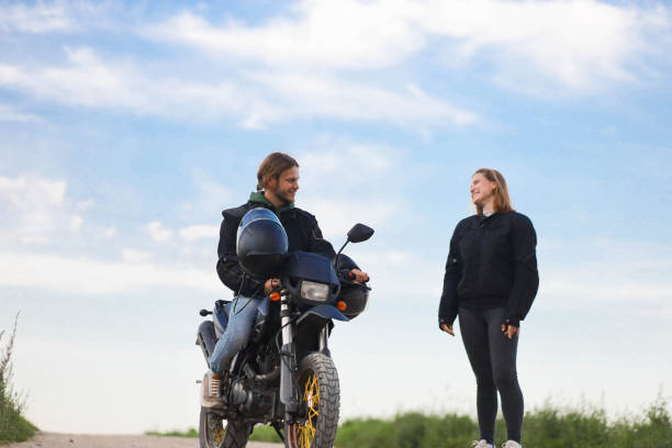 istock couple on a motorcycle in a field, date on a motorcycle 2163683093