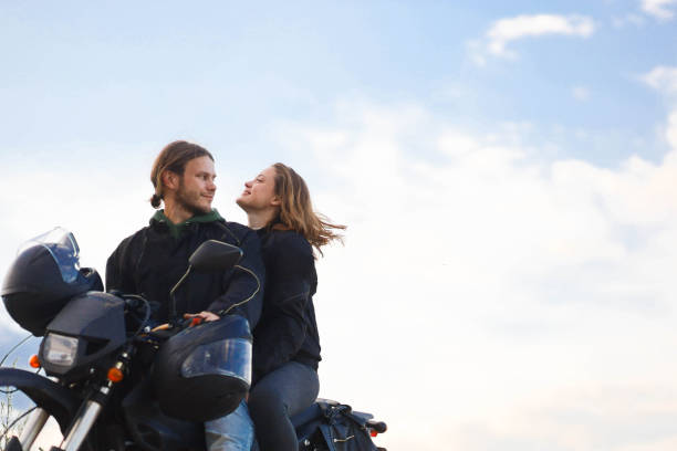 istock couple on a motorcycle in a field, date on a motorcycle 2163683299