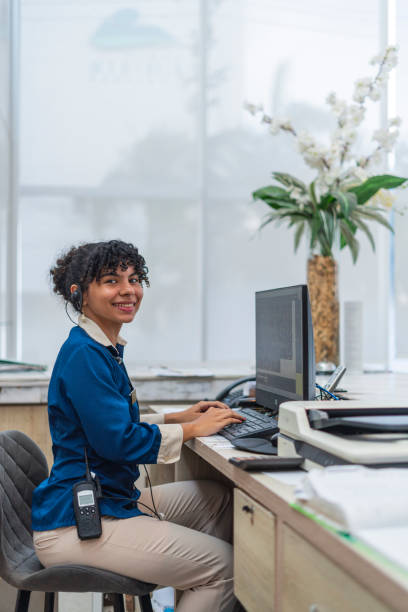 istock woman receptionist in hotel 2163683483