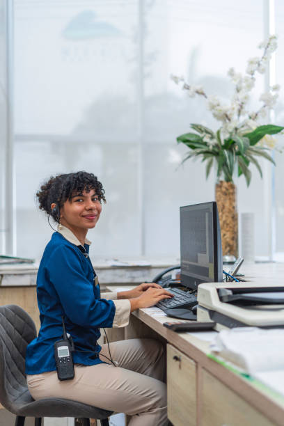 istock female receptionist in hotel 2163683508