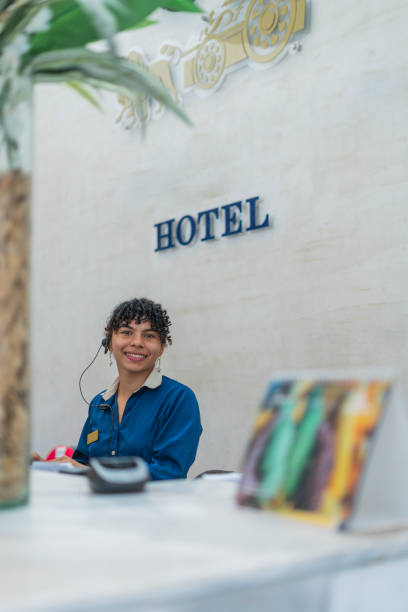 young woman receptionist in hotel smiling