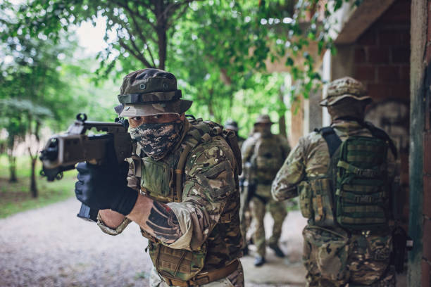 istock Tactical soldiers preparing for action in forest area 2163685873