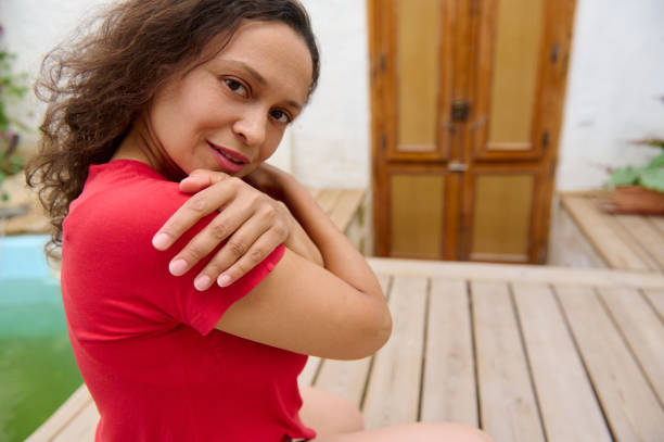 istock Woman in red shirt posing confidently outdoors in a rustic setting 2163687771