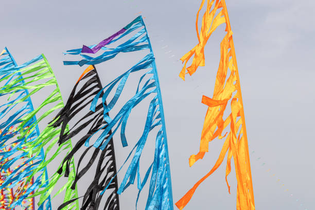 istock Colored flags against the blue sky with white clouds on holidays 2163688356