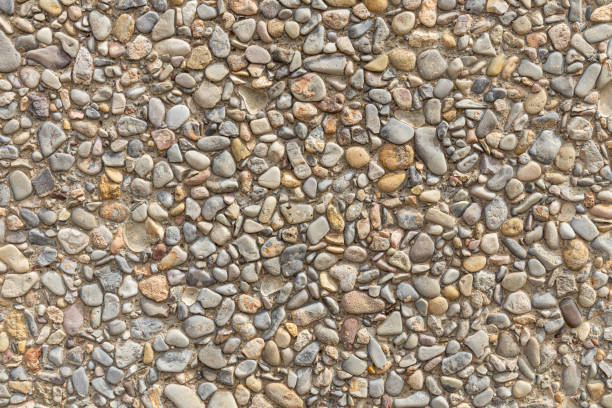 istock Beautiful texture of a wall or a path with gray and color smooth stones 2163688391