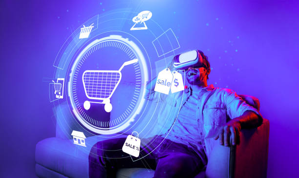 istock Happy man using VR headset and shopping online while sitting at sofa. Deviation. 2163691588