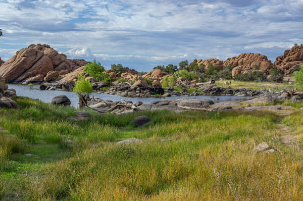 istock Scenic Rocky Landscape with River Under Cloudy Sky 2163691623