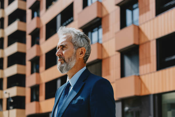 istock Confident Businessman Standing Outside Modern Building 2163692164