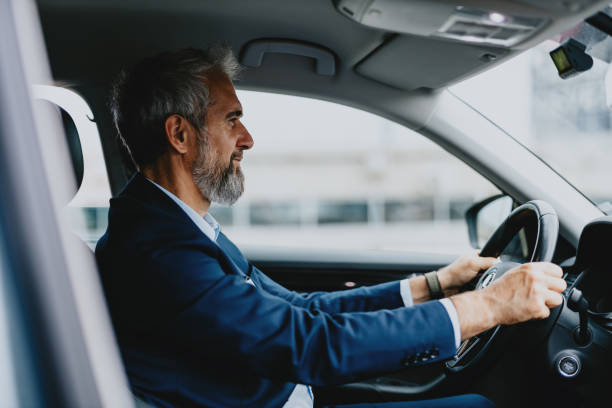 istock Confident Businessman Driving Car During Commute 2163692209
