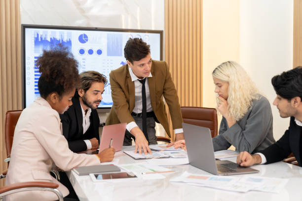istock Professional smart business team discussion about start up project. Ornamented. 2163693377