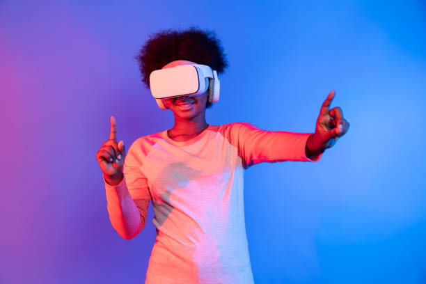istock Young African wearing VR through meta to zoom in out data learning. Contrivance. 2163694827