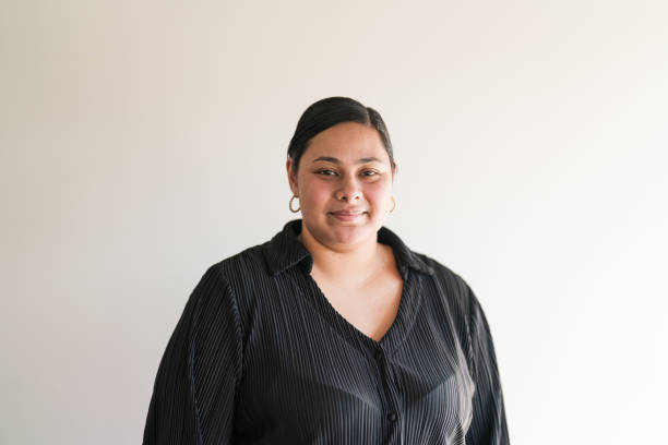istock Pacific Islander woman looking at camera against white. 2163695100