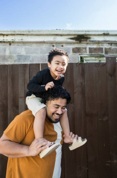 istock Riding high, playful dad and son studio shot. 2163695198