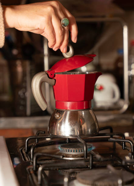 istock Hand holding a red Italian moka pot 2163695516