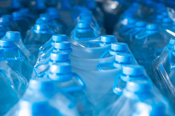 istock Packaged blue five-liter plastic bottles in the finished product warehouse 2163698120