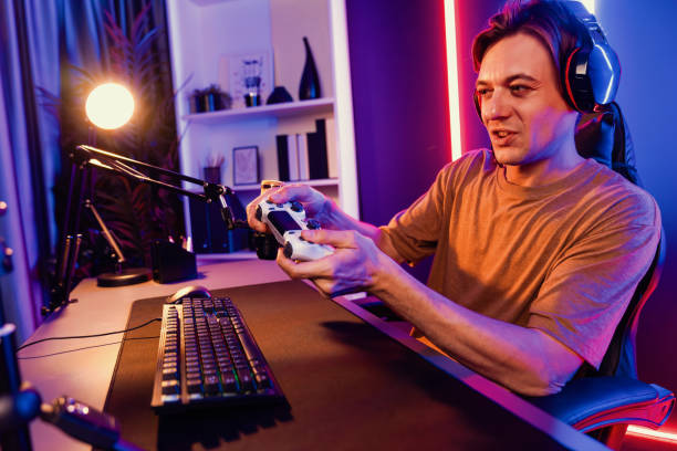 istock Streamer with control joystick live streaming by smartphone rec. Pecuniary. 2163698868