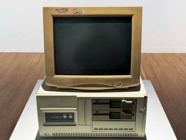 Old retro CRT monitor display with a PC isolated on white background