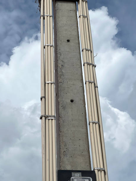 istock electric pipes on cement pole 2163700506