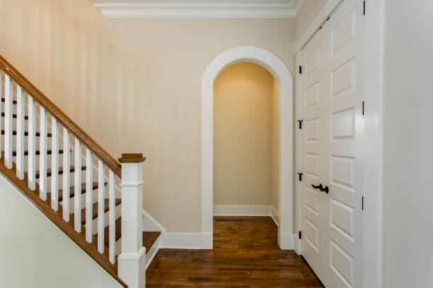 istock Interior Staircase Entrance With Wooden Steps And White Railings 2163702913