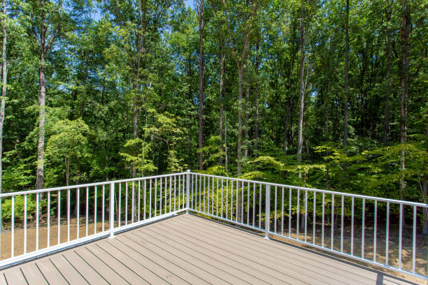 istock Spacious Open Deck With White Railings Providing A View Of Wooded Surroundings. 2163702946