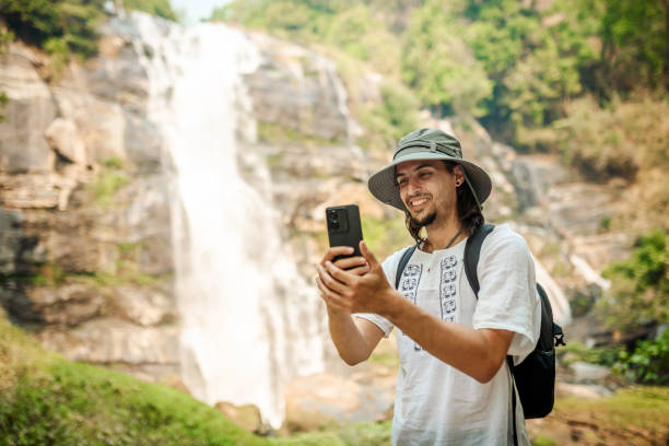 istock Young man exploring the tropical jungle 2163703172