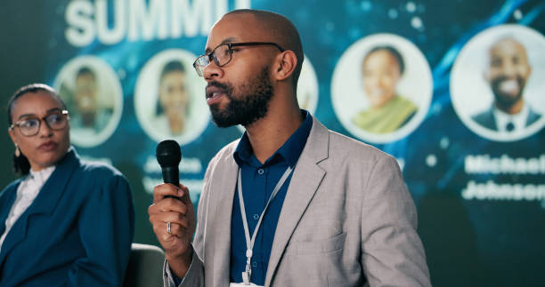 istock Presentation, black man or talking at seminar for information, climate change or sustainability. Male researcher, representative or speaking at event for environment care, lecture or conference intro 2163703253
