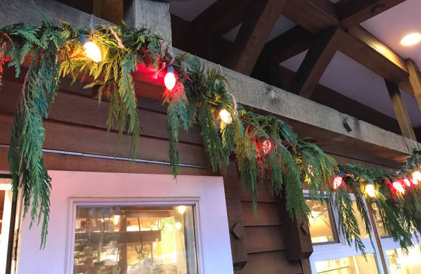 istock Christmas Pine Tree Garland With Lights and Decor For The Holidays 2163704788