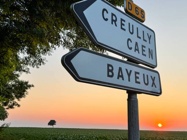 istock French road sign is framed against a twilight sun 2163707678