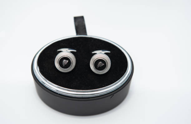 The groom's silver buttons in a round box, at a wedding in Romania