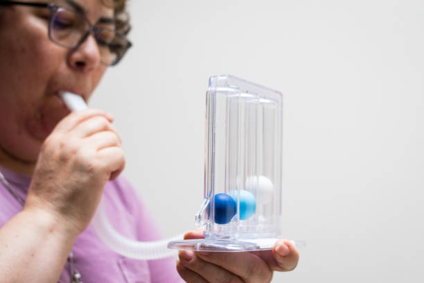istock Breathing exercises with a medical tool 2163709299
